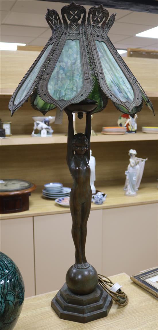 A pair of figural lamps with stained glass shades overall height 96cm